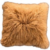 Fluffy brown pillow on a dark surface